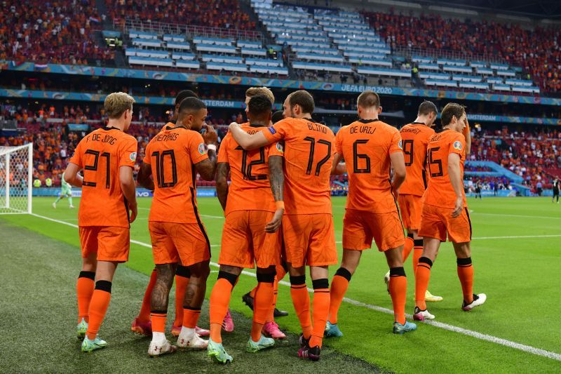 Netherlands players celebrate after Memphis Depay put them ahead against Austria