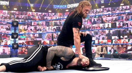 Edge attacks Roman Reigns and gets a title shot