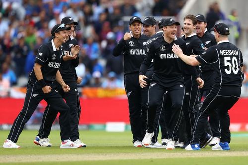 James Neesham (first from left) celebrates MS Dhoni's wicket with Martin Guptill during the 2019 Cricket World Cup semifinal