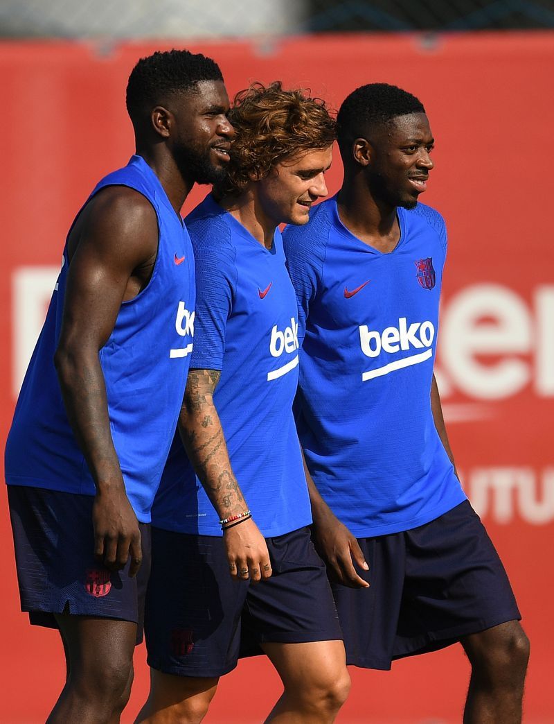 Samuel Umtiti (left) with Antoine Griezmann (centre) and Ousmane Dembele (right) training with Barcelona