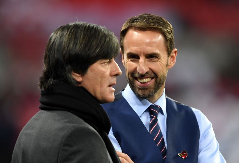 Joachim Low (left) and Gareth Southgate (right) share a moment during an international friendly