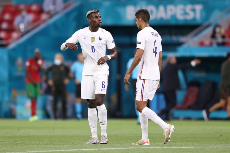 Raphael Varane (right) could partner Pogba at Manchester United. (Photo by Alex Pantling/Getty Images)