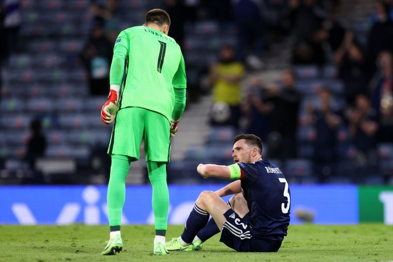 Scotland captain Andy Roberson and keeper David Marshall look disappointed after their defeat to Croatia