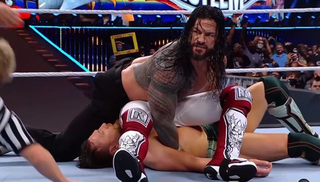 Roman Reigns with a comprehensive victory over Edge and Bryan at Wrestlemania