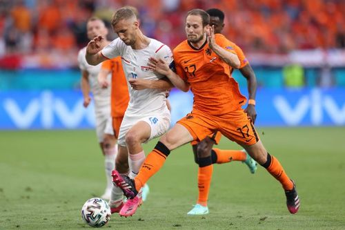 Netherlands' Daley Blind (right) battles for the ball with Czech Republic's Tomas Soucek (left) during their Euro 2020: Round of 16 clash