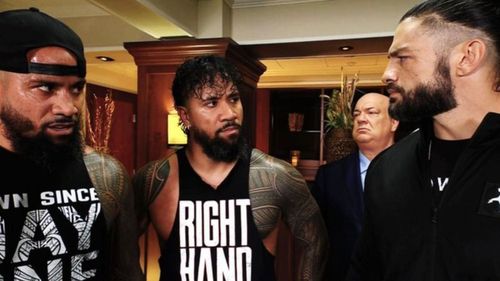 The Usos, Roman Reigns, and Paul Heyman