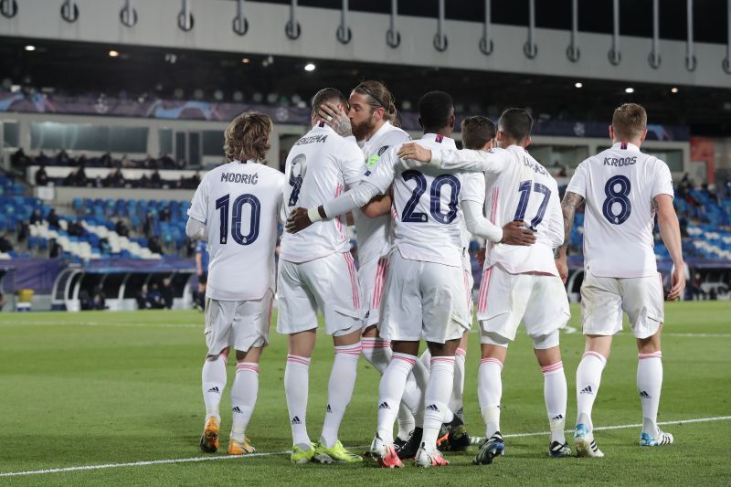 Real Madrid players celebrate a goal against Atalanta.