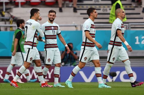 Cristiano Ronaldo's brace secures a crucial victory for the reigning champions against Hungary.