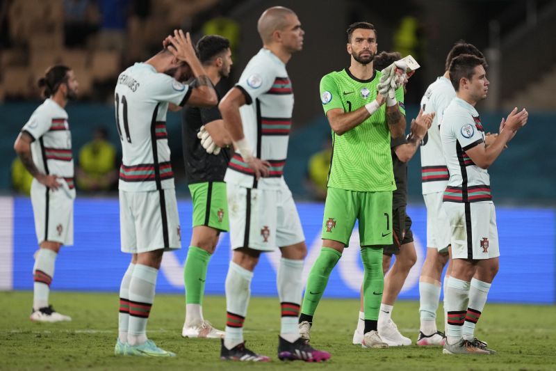 Portugal players react after their loss to Belgium in the Euro 2020 Round of 16