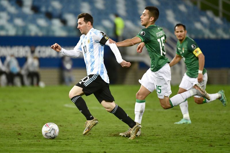 Messi carries the ball forward for Argentina