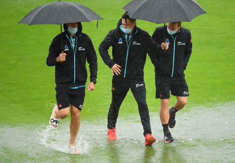 Tim Southee, Trent Boult and Neil Wagner of New Zealand near the boundary on the wet outfield in Southampton. Pic Getty Images