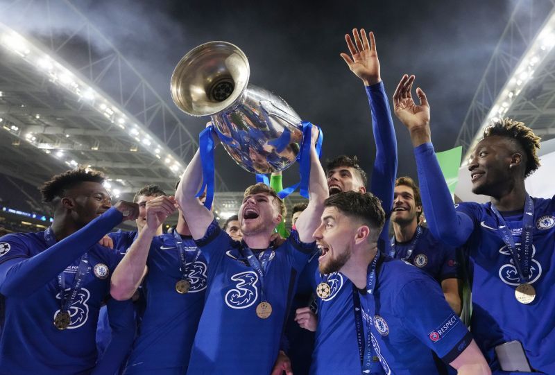 Timo Werner holding aloft the UEFA Champions League trophy after defeating Manchester City