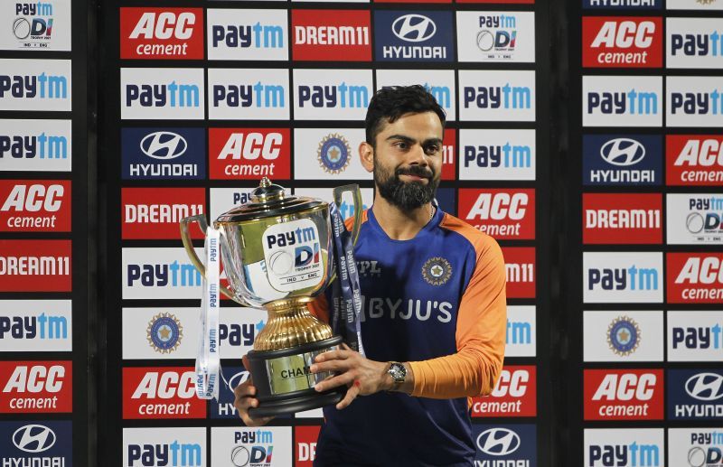 Virat Kohli poses with the Paytm trophy after beating a dominant England 2-1 at home in 2021.