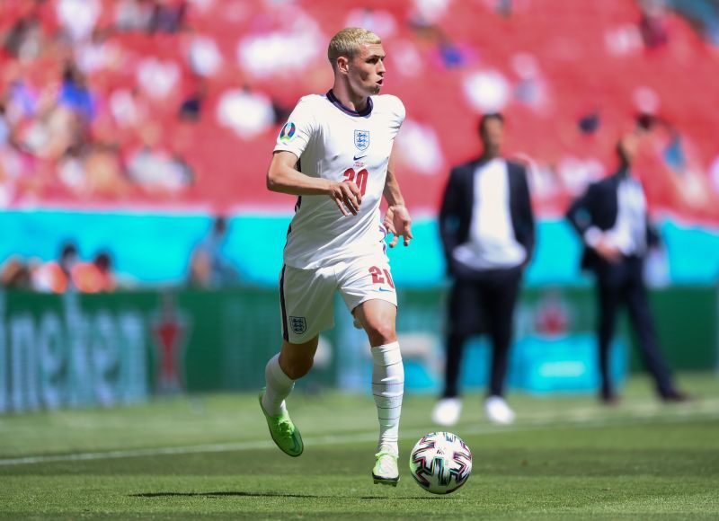 Phil Foden carries the ball for England at Euro 2020