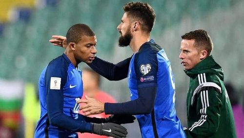 Tensions are running high between Kylian Mbappe and Olivier Giroud... it appears. Giroud and Mbappe (centre) celebrate France's FIFA World Cup win