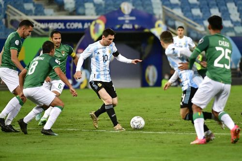 Argentina's Lionel Messi dribbles while being surrounded by Bolivia players during the teams' Copa America clash