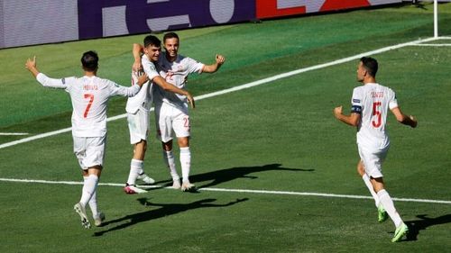 Spain emphatically beat Slovakia to qualify for the last-16.