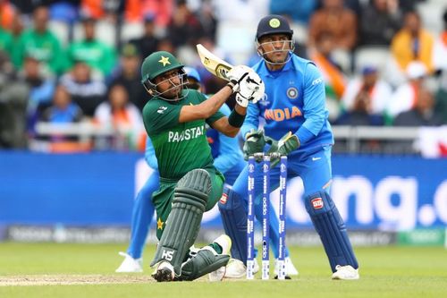 Babar Azam (L) and MS Dhoni