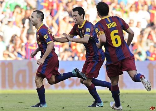 Andres Iniesta, Sergio Busquets and Xavi