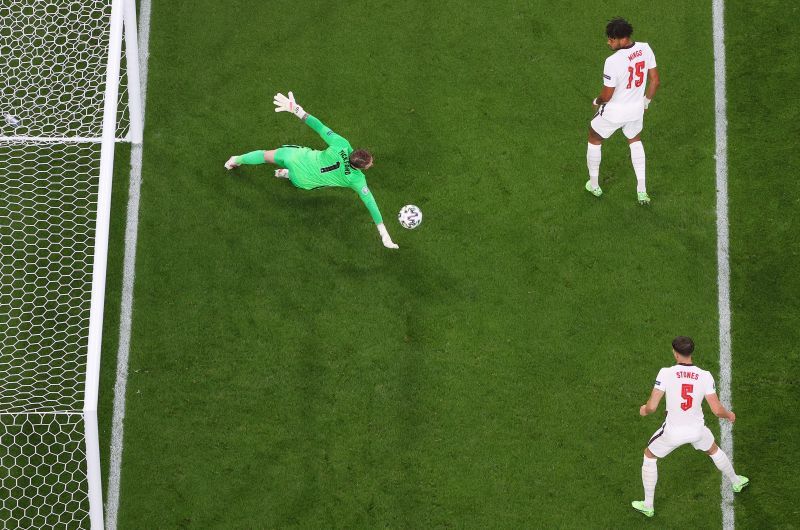 Jordan Pickford of England makes a save from a shot from Stephen O'Donnell