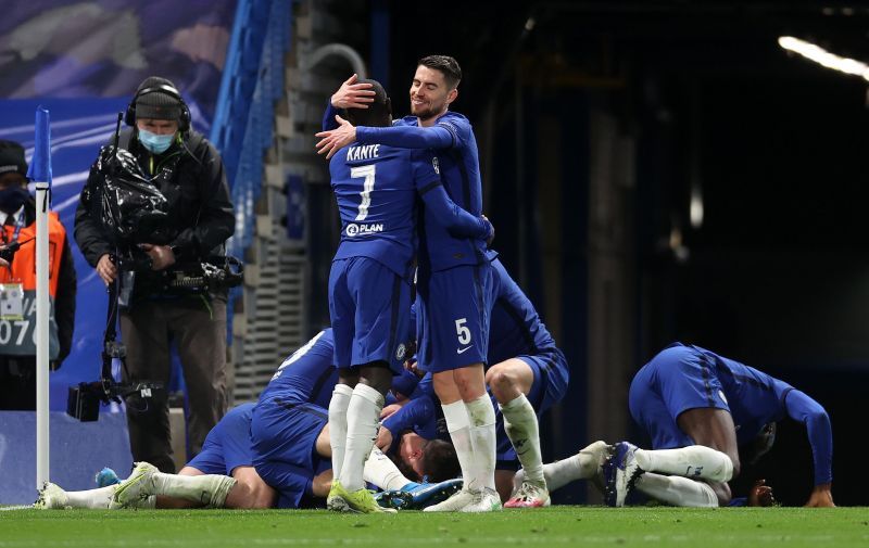 Chelsea's N'Golo Kante (number seven) and Jorginho hug each other.