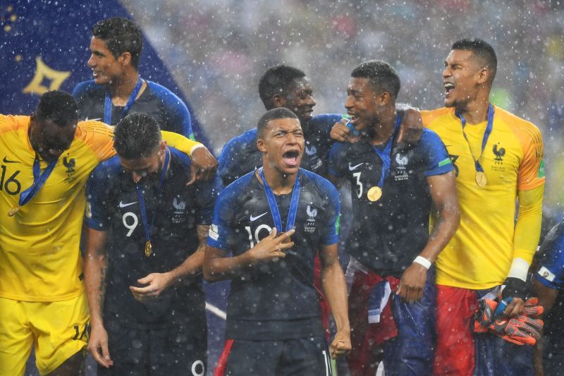 Giroud and Mbappe (centre) celebrate France's 2018 FIFA World Cup win