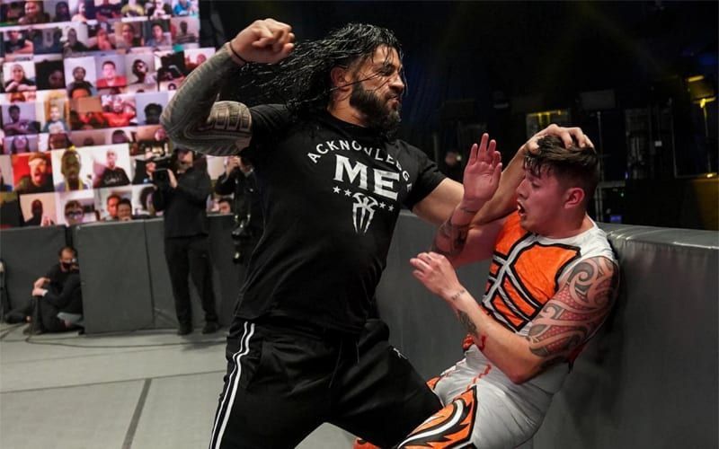 Dominik Mysterio getting assaulted by Roman Reigns