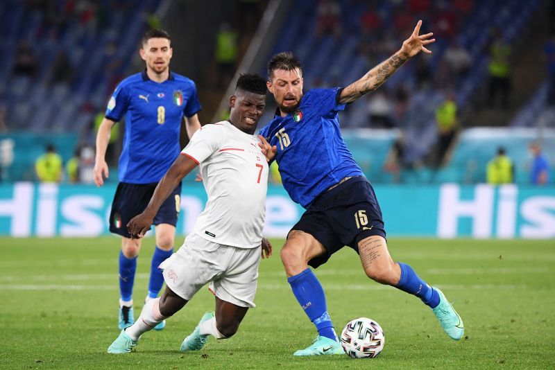 Italy saw off Wales to cap off a perfect group-stage campaign.