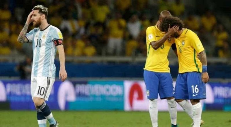 Lionel Messi (left) is distraught after a Brazil goal