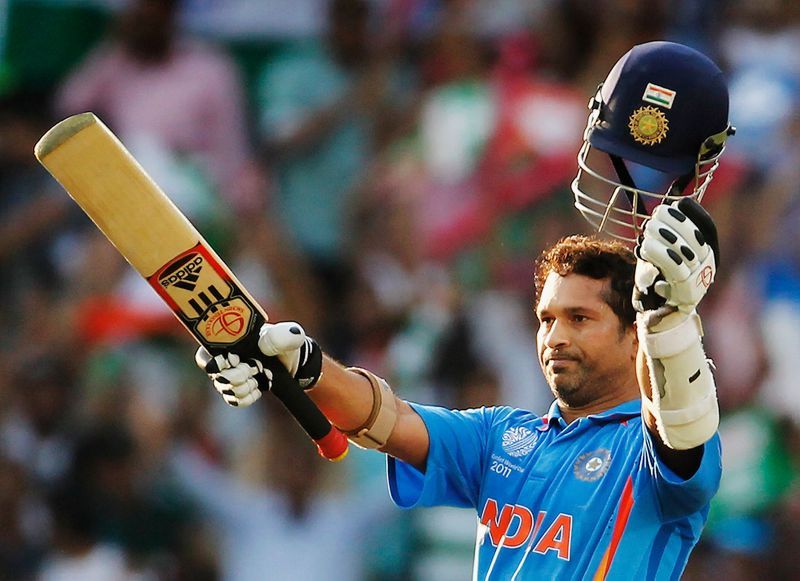 Sachin Tendulkar celebrates his 99th international hundred during the 2011 World Cup.