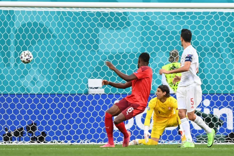 Denis Zakaria (n red) put one through his own net against Spain