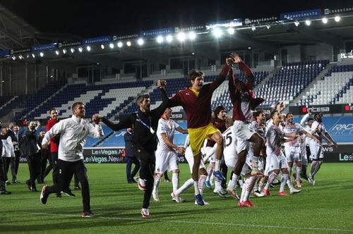 AC Milan players celebrate a victory last season