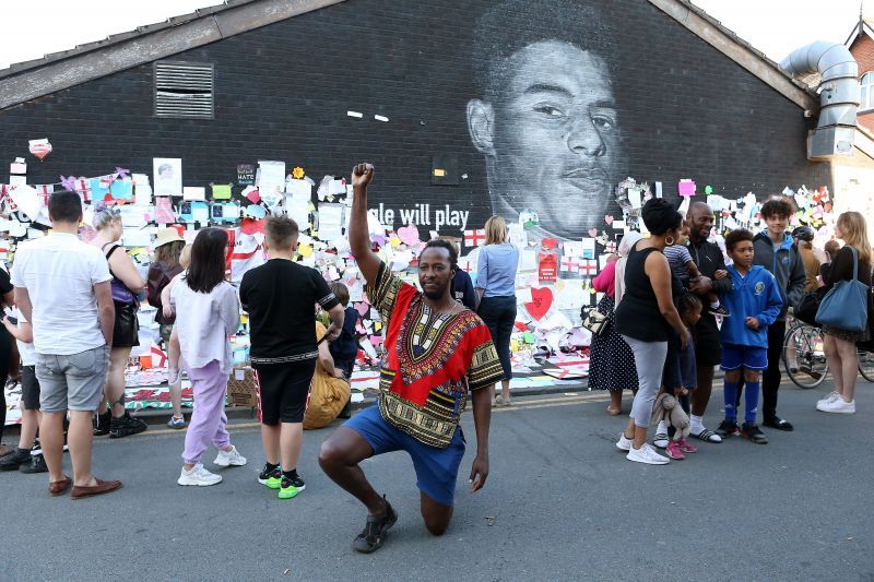 Defaced Mural Of Marcus Rashford Repaired By The Artist In Manchester