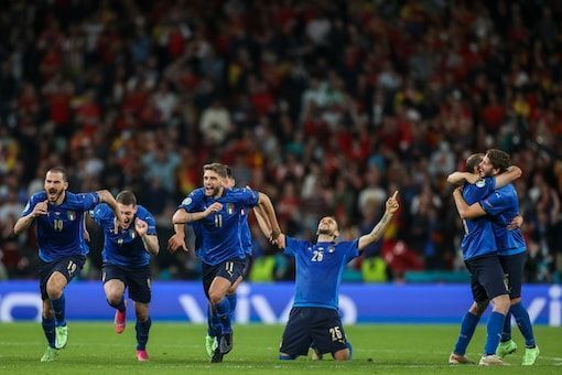 Italy players exult after winning the semi-final shootout against Spain