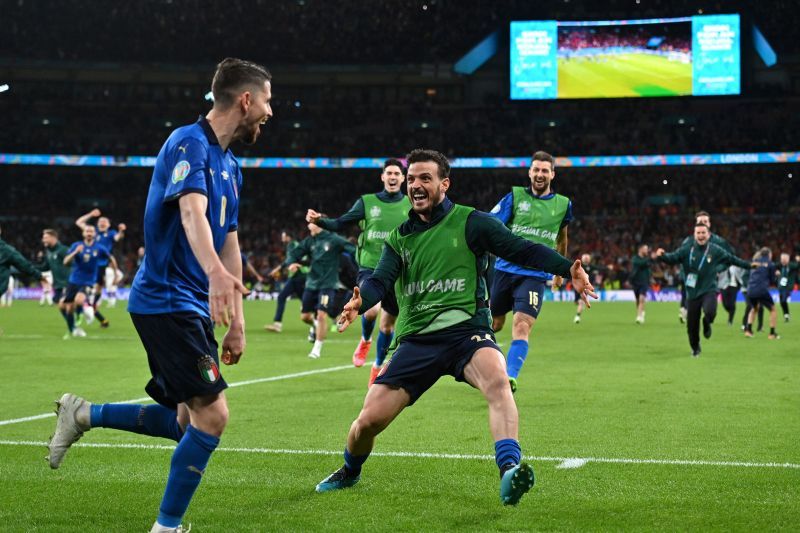 Italy players rejoice following their penalty-shootout victory against Spain.