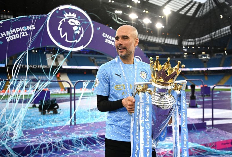 Pep Guardiola with the 2020-21 Premier League title