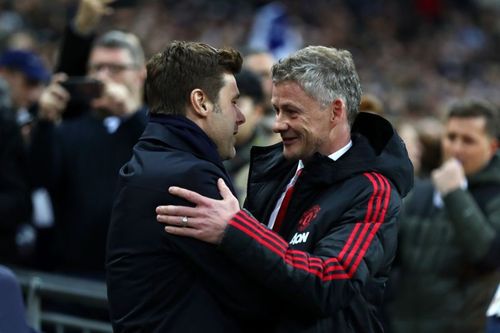 Manchester United manager Ole Gunnar Solskjaer with Mauricio Pochettino. (Photo by Clive Rose/Getty Images)