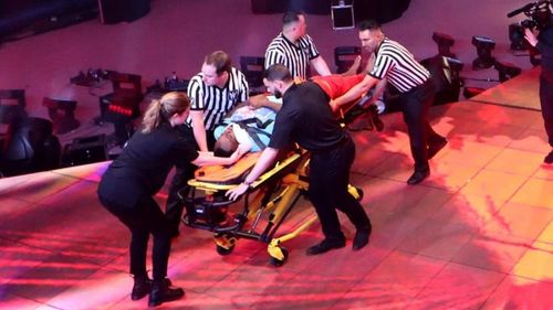 Big E being stretchered out of a WWE event