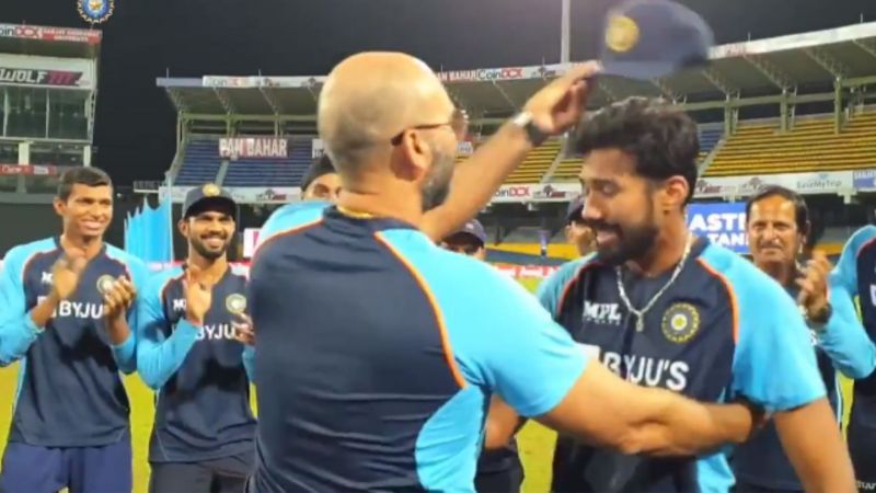 Sandeep Warrier receiving his India cap from bowling coach Paras Mhambrey