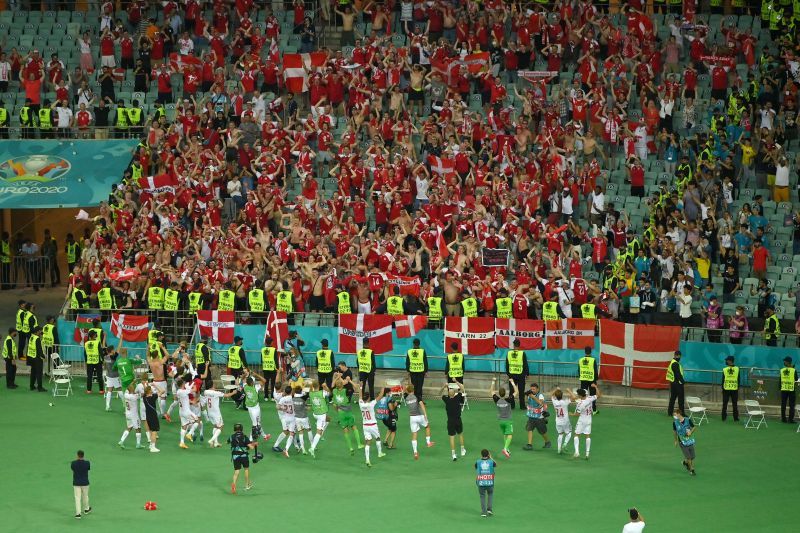 The Denmark players celebrate with their fans