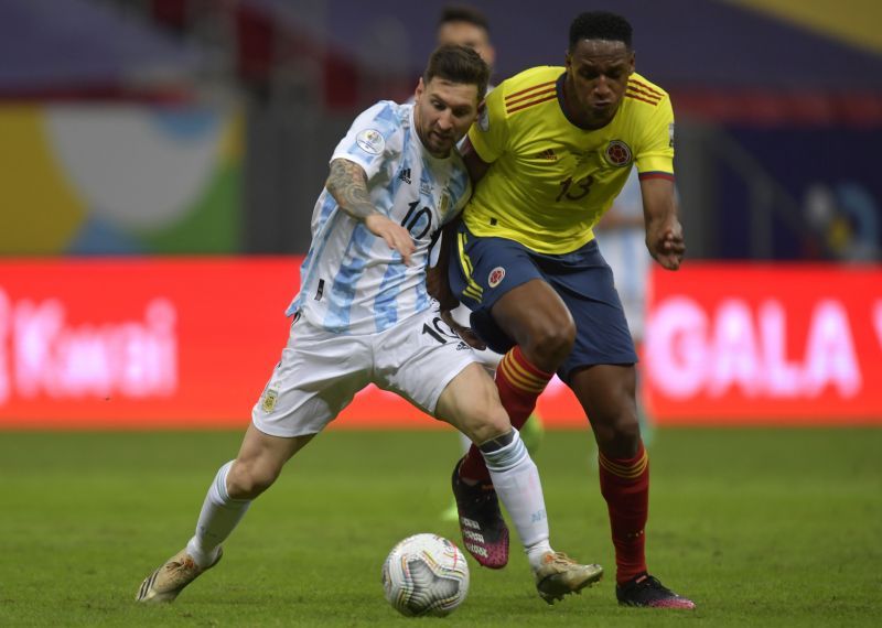 Yerry Mina (right) fights for the ball against Lionel Messi during the Copa America 2021 semifinal