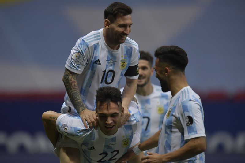 Messi and Lautaro Martinez celebrate after Argentina's opener against Colombia