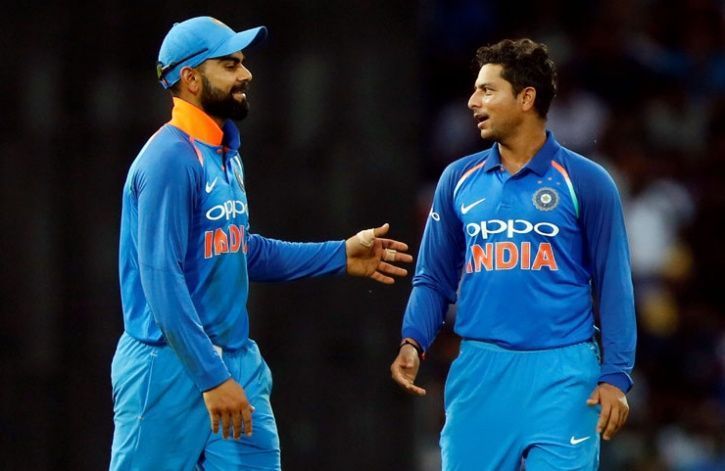 Virat Kohli (L) and Kuldeep Yadav