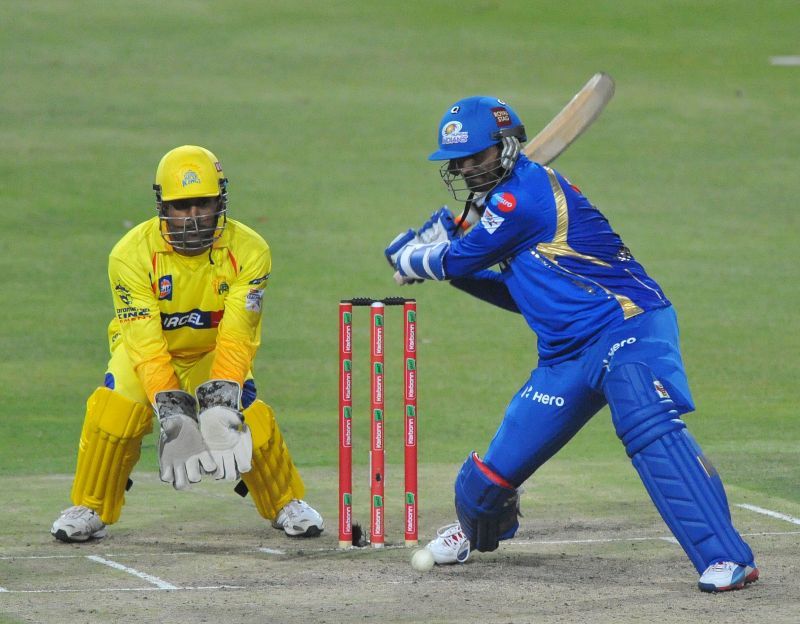 MS Dhoni and Harbhajan Singh in action during Champions League T20
