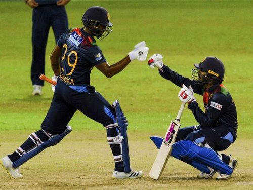 Sri Lanka's Chamika Karunaratne and Dhananjaya De Silva after a win (P.C. Twitter)