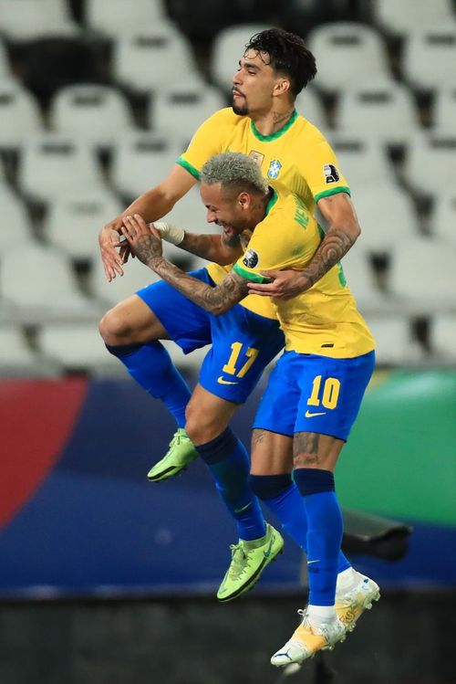 Neymar and Lucas Paqueta celebrate Brazil's goal against Peru