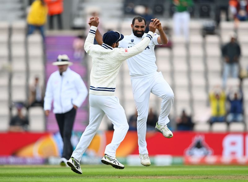 Mohammed Shami (R) celebrates a wicket
