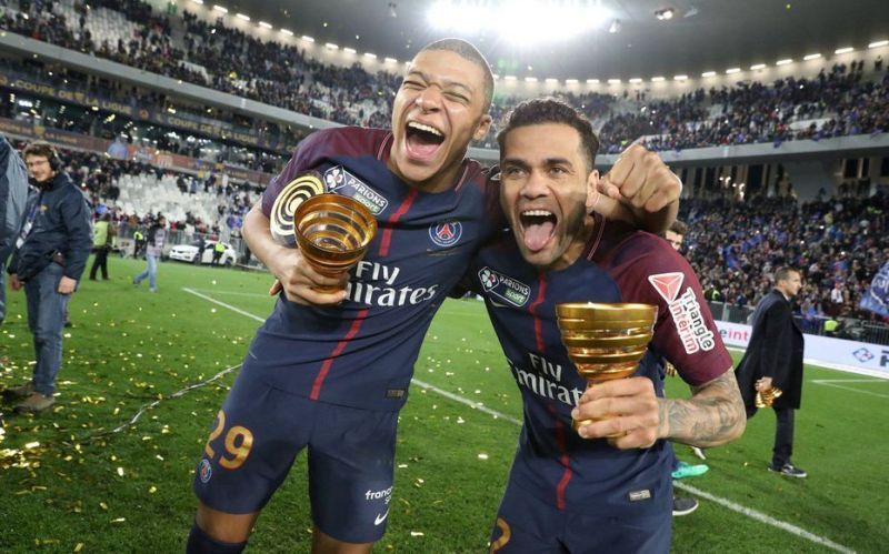 Dani Alves (left) has played close to 1,000 games in his professional career.