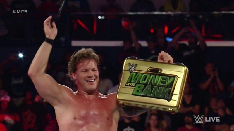 Chris Jericho holding the Money in the Bank briefcase in 2016