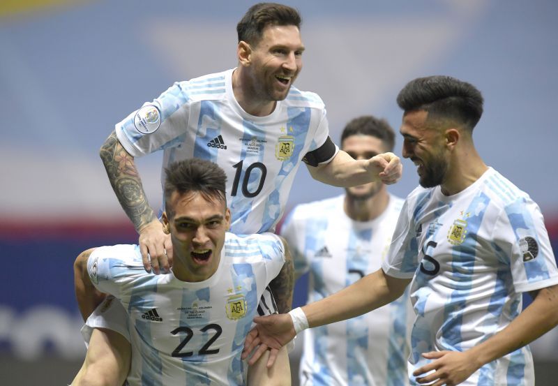 Lionel Messi (#10) exults after Lautaro Martinez (#22) scored off his assist against Colombia.